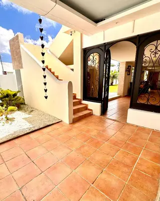 an image of a house with aoyer with a staircase at Noe hotel in Punta Cana