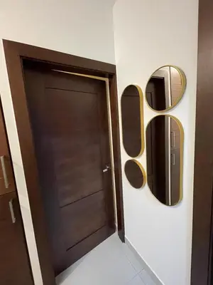 a door in a room with two mirrors at Modern Rooftop Penthouse Private Large Jacuzzi for 12 in Santiago de los Caballeros