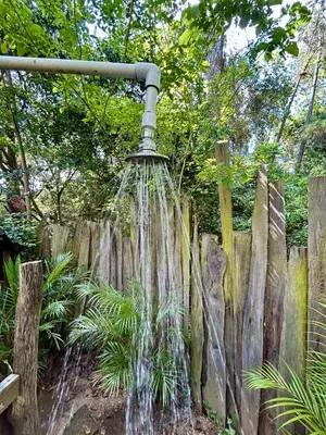 a water fountain in front of a wooden fence at Villas del lago resort in Colorado