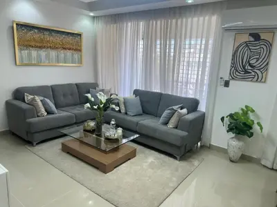 a living room with a couch and a coffee table at Elsa in Jacagua