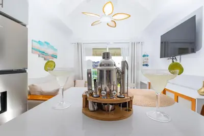 a kitchen with two glasses and a blender on a counter at View to paradise, One bedroom apartment in Puerto Plata