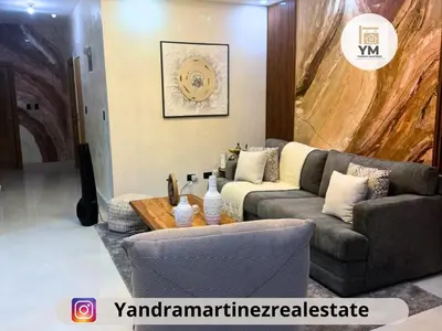 a living room with a couch and a table at Ideal amueblado, céntrico y acogedor in Los Paredones