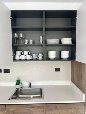 a kitchen with a sink and plates on shelves at Estrella Izha 204 in La Laguna