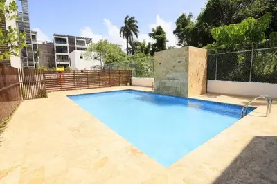 a large blue swimming pool in a backyard at Luxury Beachside Escape 3BR 2BA with Pool & Ocean Views in San Felipe de Puerto Plata