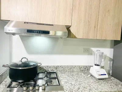 a pot on top of a stove in a kitchen at Livera park in Santiago de los Caballeros