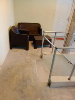 a living room with two chairs and a couch at Carvajal in El Higo