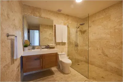 a bathroom with a toilet and a sink and a shower at Apartamento Moderno en Playa Dorada Piscina & Playa in Puerto Plata