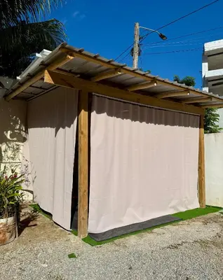a white covering on top of a fence at Residencia AKKMA - Autentico y dominicano con AC in Las Terrenas