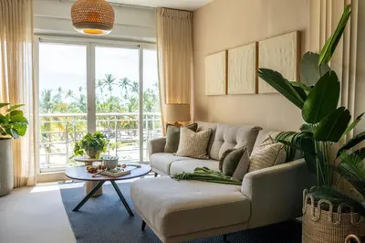 a living room with a couch and a table at Beach Pool Jacuzzi Wifi Netflix Gym 5 Guests in Villas del Mar