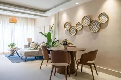 a living room with a table and chairs and a couch at Beach Pool Jacuzzi Wifi Netflix Gym 5 Guests in Villas del Mar