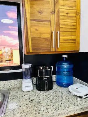 a kitchen counter with a blender on a counter top at Apartamento en la romana residencial los García I in La Romana