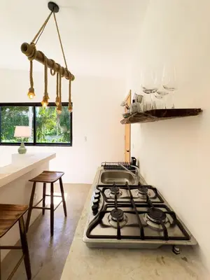 a stove top in a kitchen with a counter at Jungle Tiny House in El Valle
