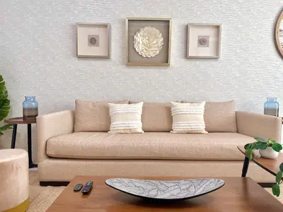 a living room with a couch and a table at Elegant City-Center Luxury Apt in Santo Domingo