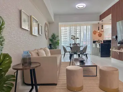 a living room with a couch and a table at Elegant City-Center Luxury Apt in Santo Domingo