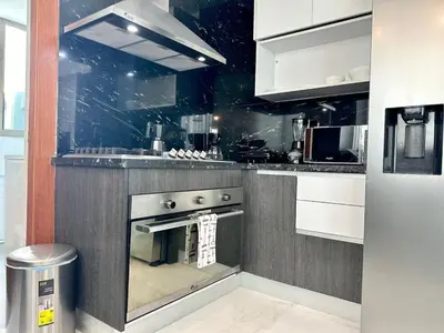 a kitchen with a stainless steel oven in a kitchen at Elegant City-Center Luxury Apt in Santo Domingo