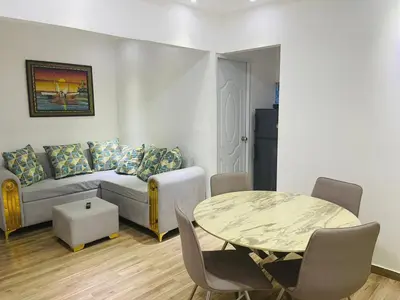 a living room with a couch and a table at La placita in Santa Bárbara de Samaná