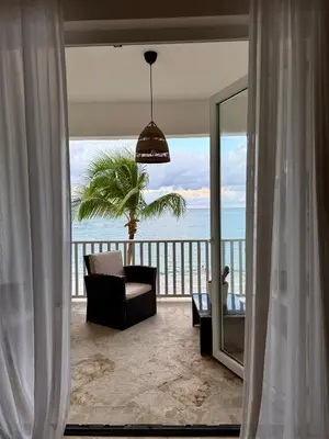 a living room with a view of the ocean at Cabarete Beach Palace 3-BDR Condo in Cabarete