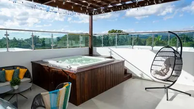 a hot tub on the balcony of a house at Luxurious PH, Near Airport,Private Jacuzzi in Santiago de los Caballeros