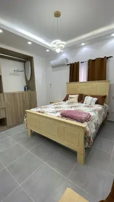 a bedroom with a large bed in a room at Villa macao in Punta Cana