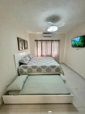 a bedroom with a large bed in a room at Your ideal escape in Puerto Plata Beach and fun in San Felipe de Puerto Plata