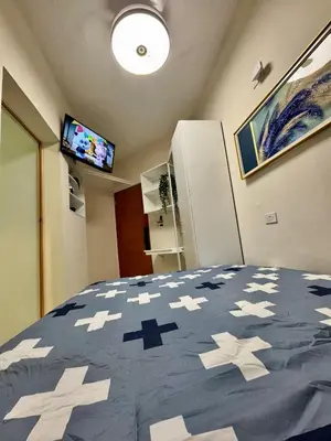 a bedroom with a bed with stars on it at Affordable room near the beach in San Felipe de Puerto Plata