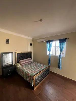 a bedroom with a bed and a window at House with Pool and Calm in La Romana