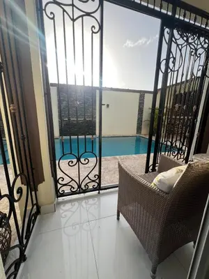 a balcony with a view of a swimming pool at House with Pool and Calm in La Romana