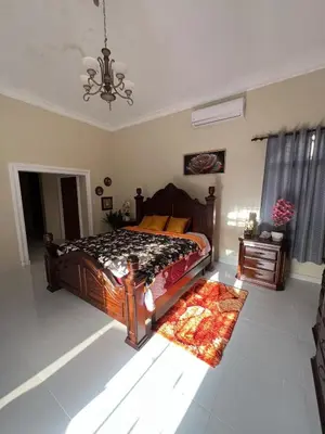 a bedroom with a bed and a rug on the floor at House with Pool and Calm in La Romana