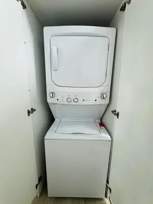 a small white refrigerator in a small room at Your ideal getaway awaits! in Punta Cana