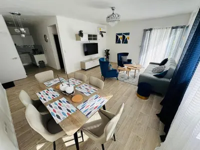 a living room with a table and chairs and a couch at Your ideal getaway awaits! in Punta Cana