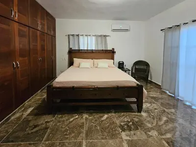 a bedroom with a large bed in a room at Magnificent accommodation in Puerto Plata