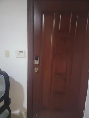 a wooden door in the corner of a room at Apartamento Minimalista in Santiago de los Caballeros