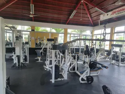 a gym with several treadmills and machines at Apartamento Minimalista in Santiago de los Caballeros