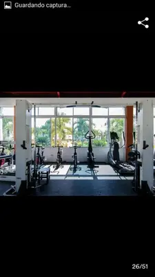 a gym with treadmills and ellipticals in a building at Apartamento Minimalista in Santiago de los Caballeros