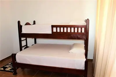 a couple of bunk beds in a room at Natural Pool Villa perfect for families in Río San Juan