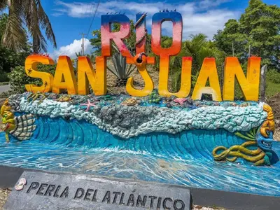 a cake with the words rue san juan on it at Natural Pool Villa perfect for families in Río San Juan