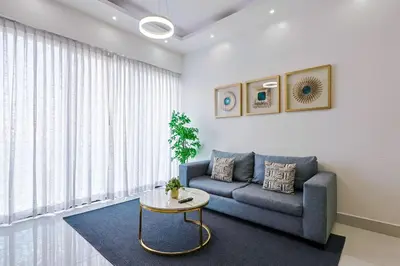 a living room with a couch and a table at Upscale Condo, Spectacular Views in Santo Domingo