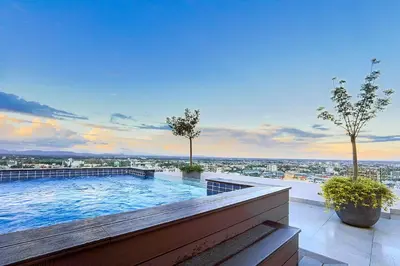 a large swimming pool on top of a building at Upscale Condo, Spectacular Views in Santo Domingo