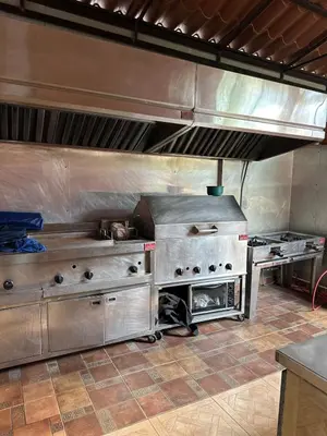 a kitchen with stainless steel appliances in a kitchen at Luxury Villa with Pool, jacuzzi,Basketball and more