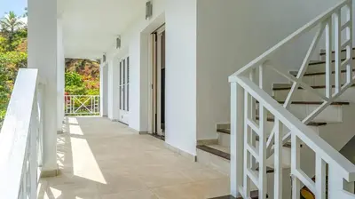 an empty hallway of a house with stairs at Casa Las Piedras in Las Terrenas