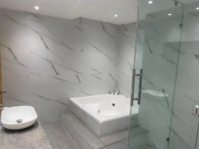 a bathroom with a tub and a toilet and a shower at Apartmento, siéntete en casa in Monte Adentro