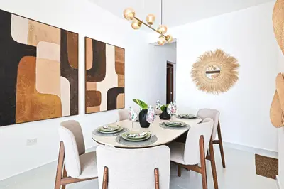 a dining room with a table and chairs at Comfy 3BD Condo in Cocotal in Punta Cana