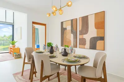 a dining room with a table and chairs at Comfy 3BD Condo in Cocotal in Punta Cana