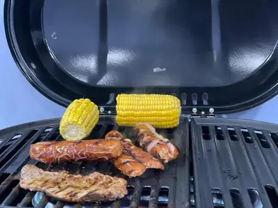 a grill with sausages and corn on it at Beach Days & City Nights! Centrally Near Everything in Santo Domingo