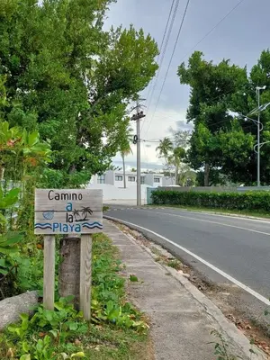 a sign on the side of a road at La Stuga del Mar - Walk to Portillo Beach, Terrenas in Las Terrenas