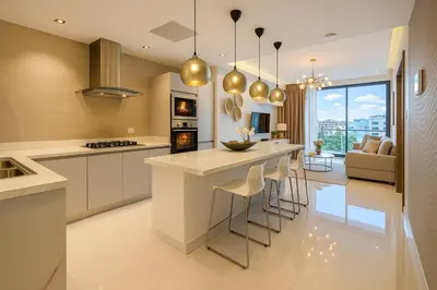 a kitchen with a island with bar stools at Upscale City Center Condo in Santo Domingo
