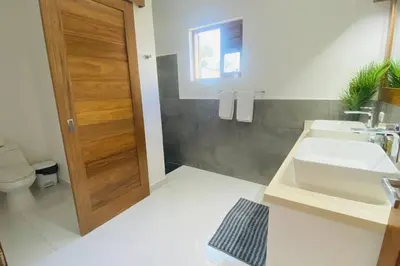 a bathroom with a sink and a toilet at Bonita Beach Villa in Las Terrenas