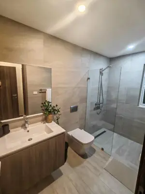 a bathroom with a sink and a toilet and a shower at Apartamento de Lujo Punta Cana Hard Rock in Punta Cana