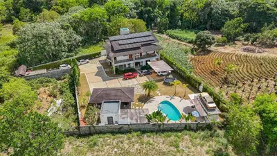 an aerial view of a house with a swimming pool at Villa Monaco RD in Concepción de La Vega