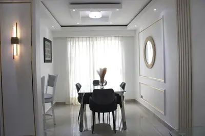 a dining room with a table and chairs at Casa Bonita con Jacuzzi in Los Mameyes